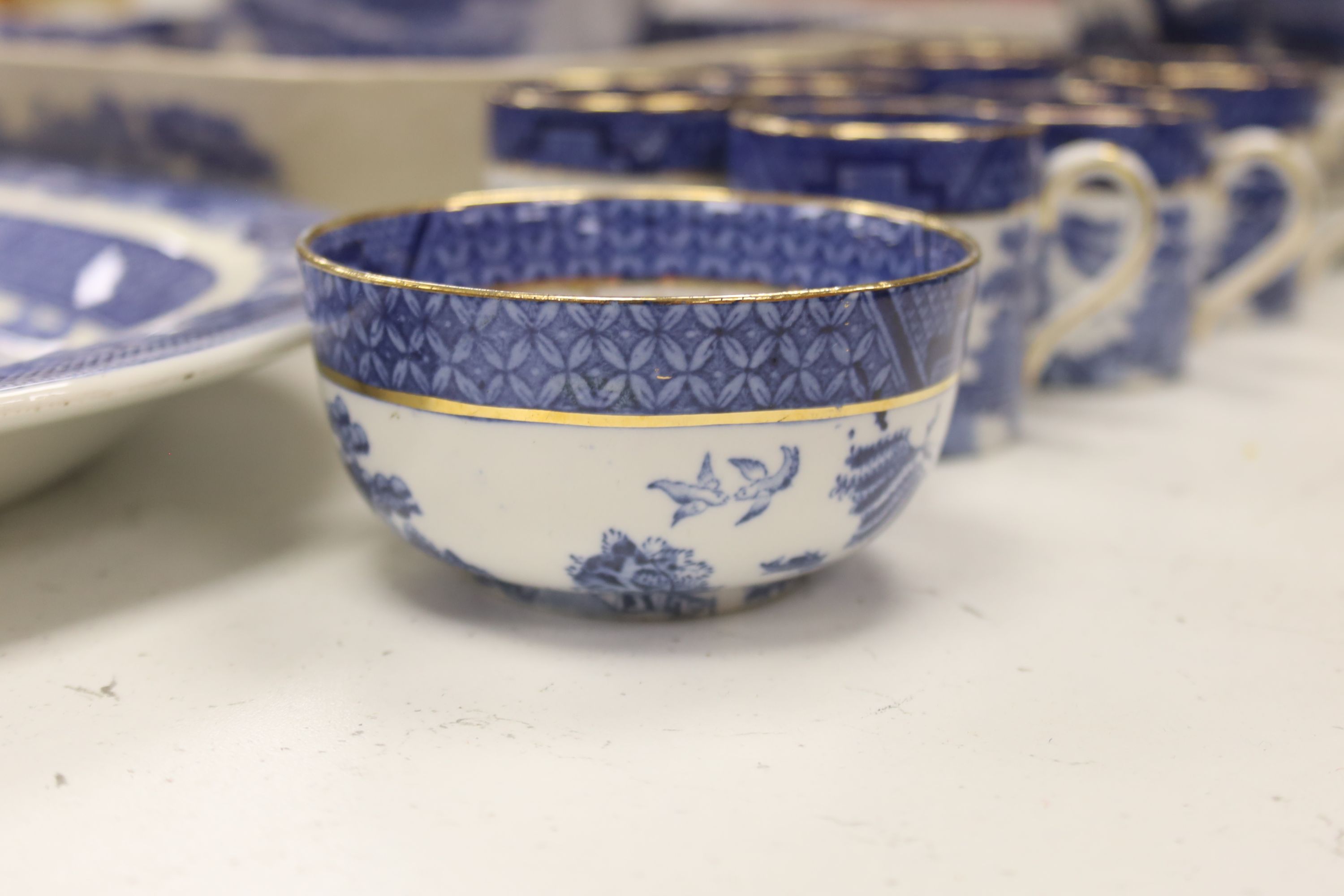 A Wedgwood blue and white willow pattern meat dish, a Copeland Spode Tower pattern square shaped bowl & a blue and white coffee pot (3)